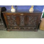 Large oak coffer, with rising lid and 2 drawers to base, with carved front pannel and lid, 94H x