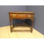 Oak side table with central drawer, brass handles & shaped frieze 79W cm