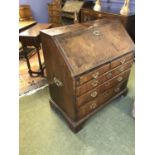 Georgian bureau of 2 short above 3 long graduated drawers, with brass campaign handles