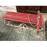 Wooden red sleigh on metal runners