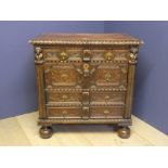 Heavily carved oak chest with brass plate & drop handles to large bun feet 97W x 97H cm