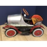 A Child's Vintage pedal car, with red wheels and silver body work, cmL