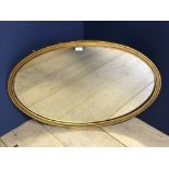 Oval shaped gilt framed wall mirror
