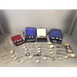 Large quantity of cased and uncased silver spoons