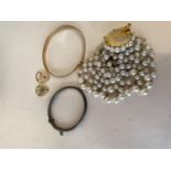 Two hallmarked gold heart lockets, a gold christening bracelet, and a hallmarked silver hinged