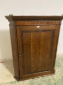 Good quality George III mahogany hanging oak corner cupboard with cross banded door and fitted
