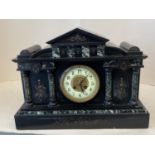 Large Victorian engraved and decorated black slate mantle clock, the circular dial with twin winding