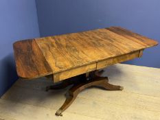 Regency Rosewood sofa table on a quadraform base with brass lion paw feet with a drawer to either