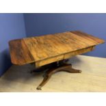 Regency Rosewood sofa table on a quadraform base with brass lion paw feet with a drawer to either