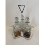 Contemporary chromium three decanter stand CONDITION: minor chips to bottle stoppers