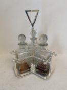 Contemporary chromium three decanter stand CONDITION: minor chips to bottle stoppers