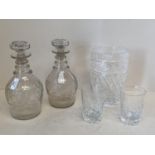 Pair of Regency cut glass decanters with ring necks and mushroom stoppers 24cm & 26cm H, cut glass