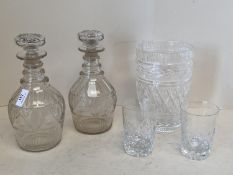 Pair of Regency cut glass decanters with ring necks and mushroom stoppers 24cm & 26cm H, cut glass