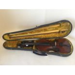 German violin Circa 1890, labelled Stradivarius with black case & bow CONDITION: good, fake wear