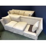 Pair of cream sofas (some cushions missing)