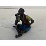 Cold painted man smoking pipe