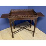 C20th Chipendale style mahogany side table with a slide to each end