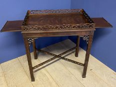 C20th Chipendale style mahogany side table with a slide to each end