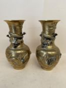 Pair of Chinese embossed brass vases decorated with dragons, seal marks to base, 23.5cm H CONDITION: