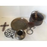 An engraved oriental bronze urn, a C19th cast iron cauldron, an oriental beaten brass tray, a