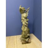 Weathered marble statue of a winged cherub on a ball and square stand, 94cmH, CONDITION: one wing