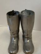 Pair of miniature hunting boots, in metal with hollow legs for stands