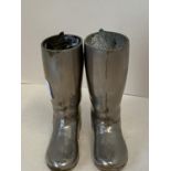 Pair of miniature hunting boots, in metal with hollow legs for stands