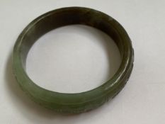 C19th Chinese Spinach Jade bangle with carving of Chinese Calligraphy to exterior 9cm diam