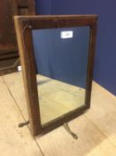 Edwardian mahogany toilet mirror and a Victorian adjustable shaving mirror on adjustable brass