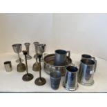 Quantity of Pewter and other tankards, tot thimbles, beakers, candlesticks, brass bells etc