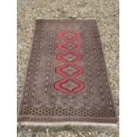 All over fawn ground rug with 5 pink central medallions