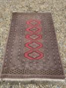 All over fawn ground rug with 5 pink central medallions