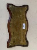 Old brass serpentine shaped Cribbage board 27cm L CONDITION: General wear