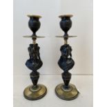 Pair of classic style Bronze an ormolu candle sticks 25H CONDITION: No visible signs of damage,