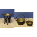 2 brass cooking pots, and an Indian brass top table with inlaid folding legs