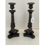 Pair of bronze and Ormolu classical style candlesticks on paw triform bases. 29cm H CONDITION: