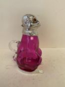 Contemporary cranberry coloured glass decanter with hinged lid in the form of a monkey 20cmH