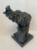 Contemporary verdigrated bronze polar bear on a stump with black marble stand. 21cm sq 38cm H