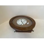 Swiss oak cased oval wall clock, the circular dial with twin winding holes, L S Hoffer, A GENEVE;