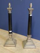 Pair of classical Adam style Corinthium column and marble style lamp stands, on stepped base