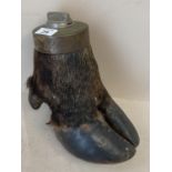 A taxidermy of a hoof, the top fitted with a lighter