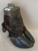 A taxidermy of a hoof, the top fitted with a lighter