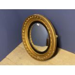 Irish style circular gilded convex wall mirror with ball decoration 58 cm. Frame damaged