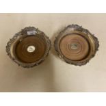 Pair of heavy silver plate wine magnum size table coasters, with gadrooned and shell borders and