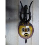 19th century (lvory coast) Lunar mask, polychrome decorated with yellow face within red star burst