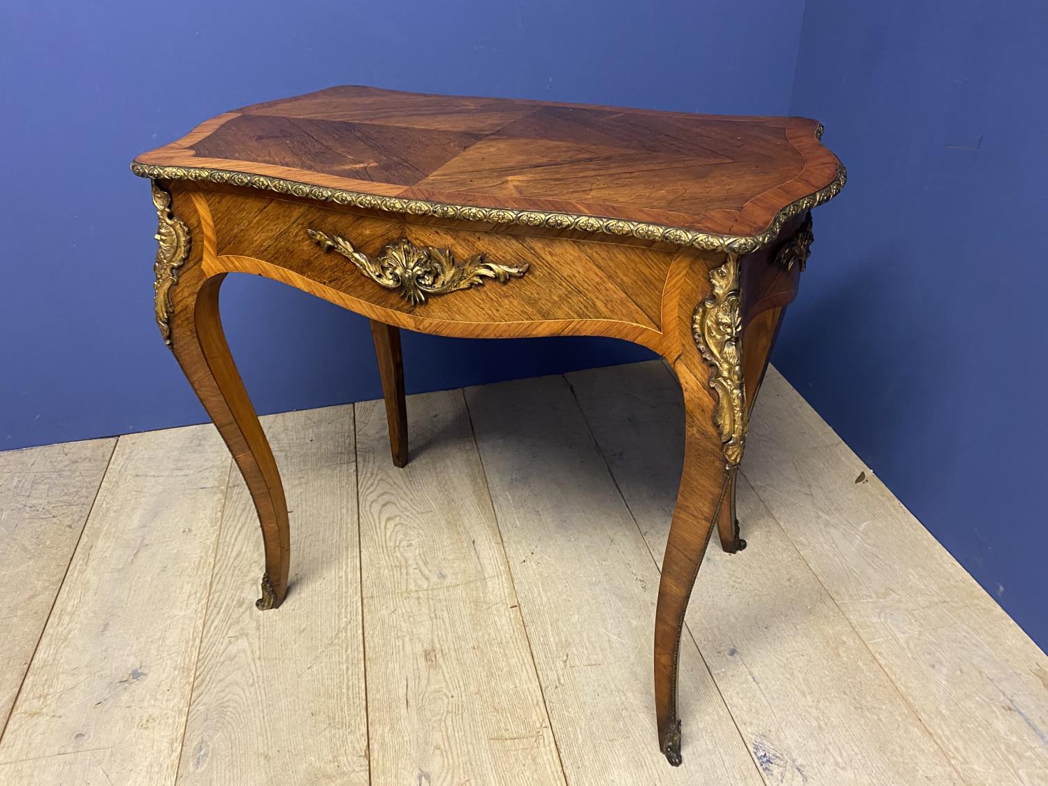 A good Continental crossbanded kingwood serpentine side table with ormolu decoration 83cmL