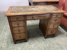 Small mahogany desk of 9 drawers, green tooled leather top 113cmW x 56D x 74cmH (condition: