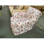 Traditional drop seat armchair in loose floral cover