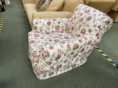 Traditional drop seat armchair in loose floral cover