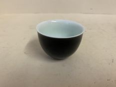 Chinese black ceramic tea bowl, Chinese marks to base, 7cm diameter,